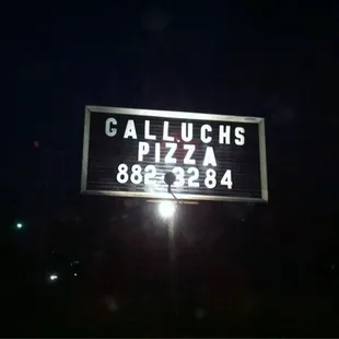 a sign for galluchs pizza
