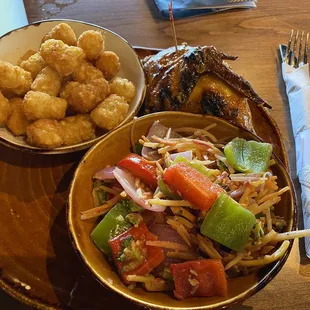 Classic Tater Tots, sautéed vegetables 1/4 Chicken Leg and Thigh grilled chicken.