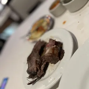 Beef ribs and bacon wrapped filet
