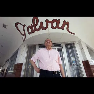 a man standing in front of the entrance