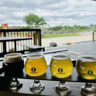 Flight with playground in background. We loved sunny IPA grapefruit!