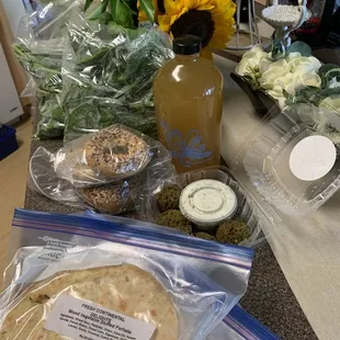 My Sunday haul: kombucha, falafel, stuffed mixed veggie parhata, flowers, spinach, bagels and romaine lettuce