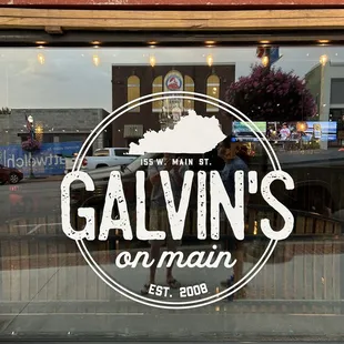 a reflection in the window of a restaurant