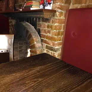 Sitting in the booth by the fireplace