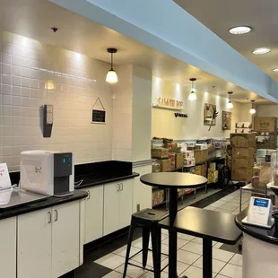 a kitchen with tables and chairs