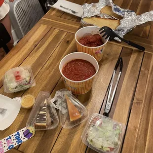 Pound of pasta, 10 meatballs, half loaf garlic bread, two side salads, cheesecake