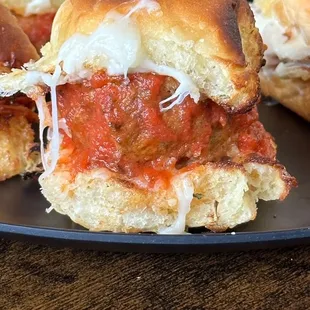 a plate of meatball sliders