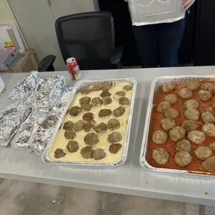 Perfect catering, half white sauce/ half red! Tons of garlic cheese bread wrapped up next to it.