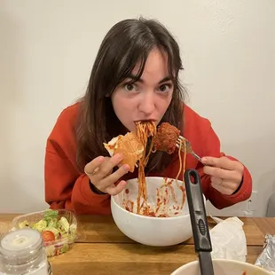 Chowing down on those yummy meatballs