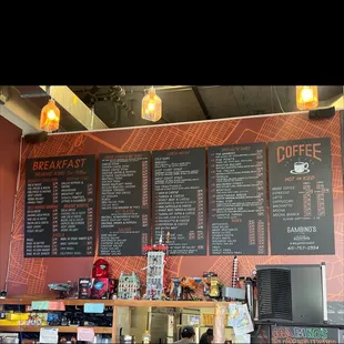 Photo of Gambino's Menu. There are more placards around the cashier's desk.