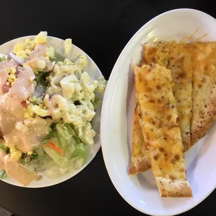 Cheese pizza and tossed and macaroni salads.
