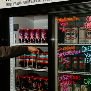 Beer cooler stocked with our 4-packs to go.