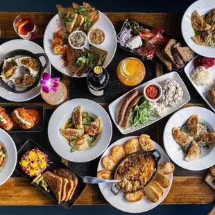 a spread of food on a wooden table