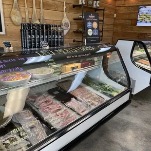 a display of meats and vegetables