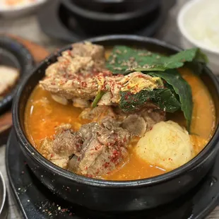 a bowl of stew with meat and vegetables