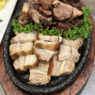 a platter of meat and vegetables
