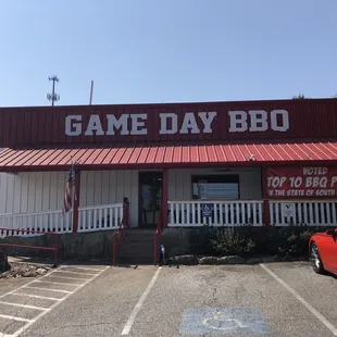 a car parked in front of a restaurant