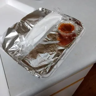 Tin foil to keep the heat in. Hot BBQ sauce.