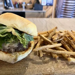 Elk burger with Brie, greens and bone marrow aioli. Side of duck fat fries.