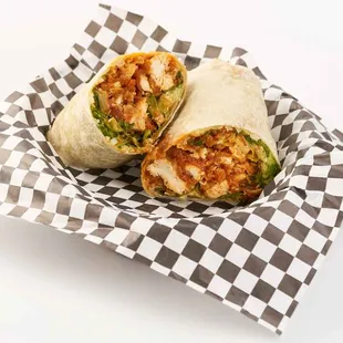 a burrito wrapped in a checkered paper