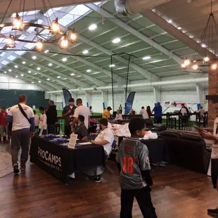 Hosting a football camp.