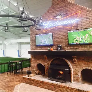 Our comfortable lodge bar with a working fireplace and HD TVs.