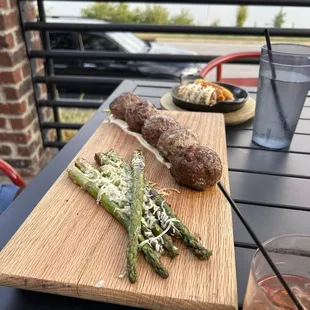 Assorted meatballs and grilled asparagus
