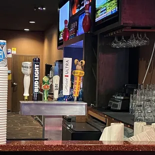 Draft beers next to adult bowling