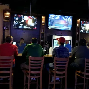 people sitting at the bar