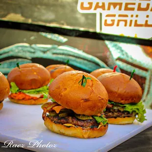 hamburgers on a cutting board