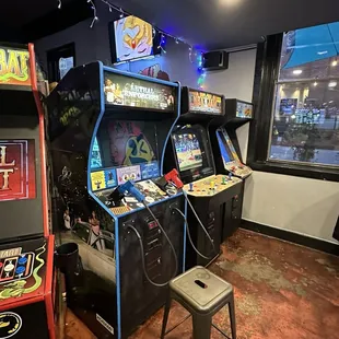 a row of arcade machines in a room