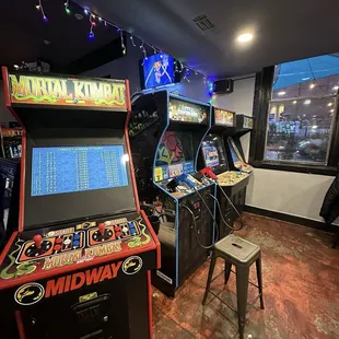 a row of arcade machines in a room