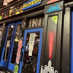the front of a building with graffiti on it