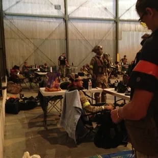 Lobby, there are charging stations and tables for you, as well as good ammo and beverages/food for sale.