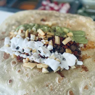 a tortilla with toppings