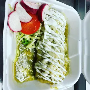 a close up of a meal in a styrofoam container
