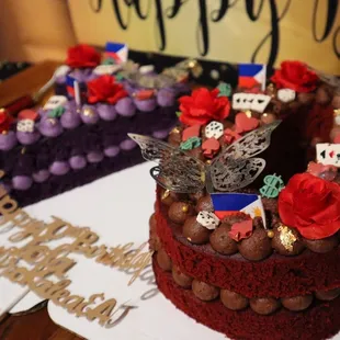 a red velvet cake with chocolate decorations