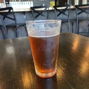 a glass of beer on a table