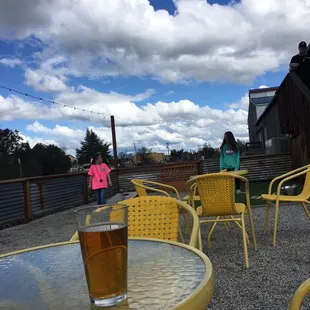 Outside deck at Gander. Enjoying some sunny weather and drinks! Fun yard games for the kids