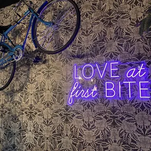 a bicycle hanging on a wall