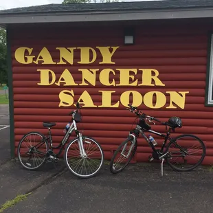 two bicycles parked in front of a building