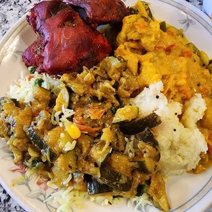 My friend's plate. Tandoori chicken, Chicken  makhani, zucchini over rice.