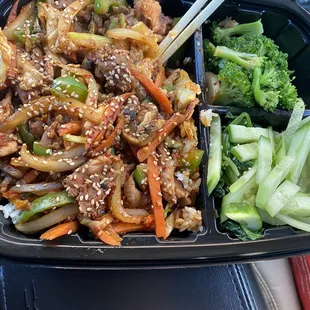 JEYUK DEOPBAP pork with steamed rice vegetables on the side