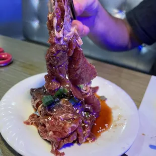 a plate of food with meat on it