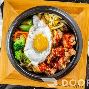 an overhead view of a bowl of food