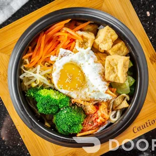 an overhead view of a bowl of food