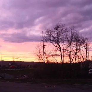 a sunset view of a parking lot