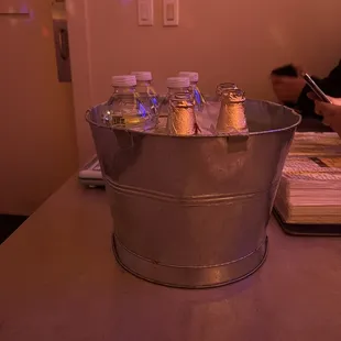 Drinks (Modelo and water) arrive in a bucket of ice.