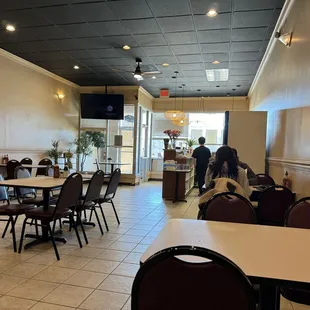 a dining area with tables and chairs