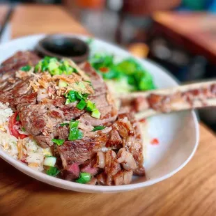 BIG GAO FRIED RICE $69.00 /Grilled 14 oz USDA Prime Ribeye Steak, Garlic Fried Rice &amp; Bone Marrow, fresh salad. Good for 2 people.